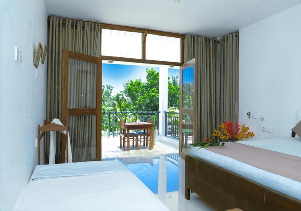 High Park Hotel Nilaveli Bagian luar foto